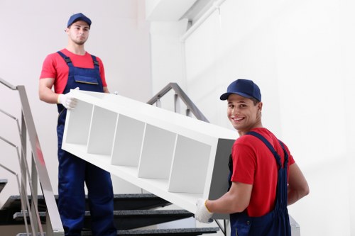Moving boxes and household items with a van in Tooting