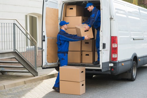 Flat removal preparation with wrapped furniture and labelled boxes