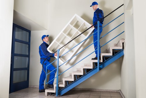 A trained removal team assessing moving risks before lifting