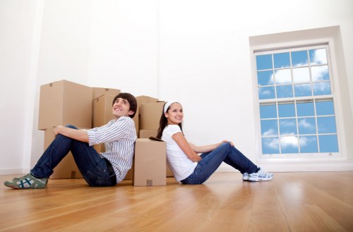 Professional movers handling furniture in a Tooting residential property