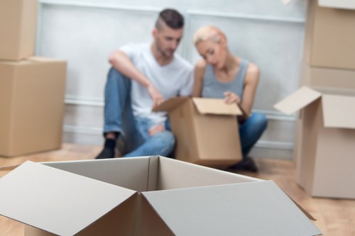 Furniture and boxes being loaded into a moving truck in South West London