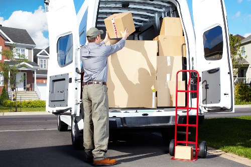 Boxes and furniture being unloaded at a new home in Tooting