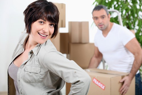 Professional movers loading items into a van near Tooting homes
