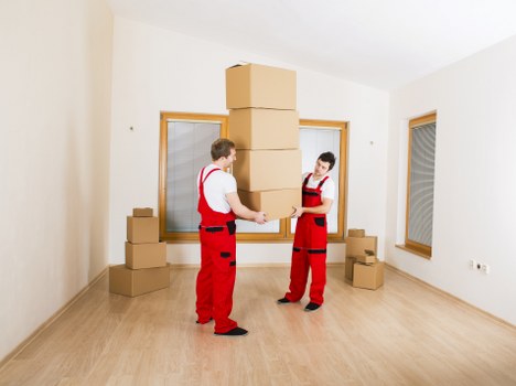 Packed household boxes and furniture ready for transport